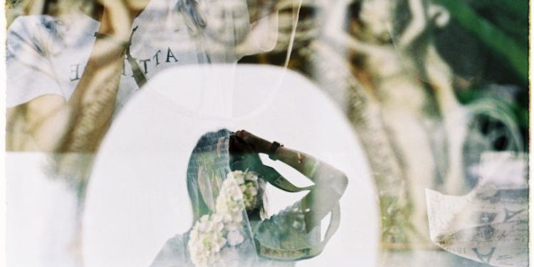 Reflection of Woman and Flowers in Window