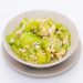 stir-fried zucchini with eggs in a white dish on a white isolated background. Thai food. Top view.
