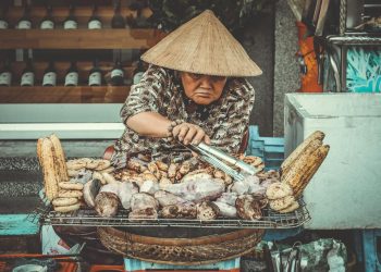 Woman Selling Grilled Root Crops