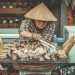 Woman Selling Grilled Root Crops