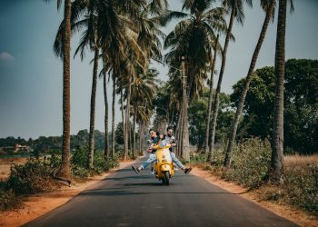 Woman and Man Riding on Motorcycle