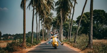 Woman and Man Riding on Motorcycle