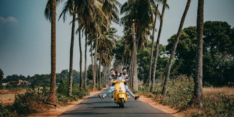 Woman and Man Riding on Motorcycle