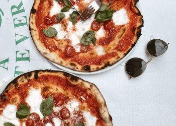 Person Slicing Pizza