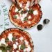 Person Slicing Pizza