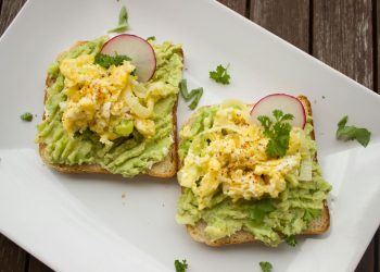 Bread With Guacamole, Parsley Leaves, Onions, and Eggs on Platter
