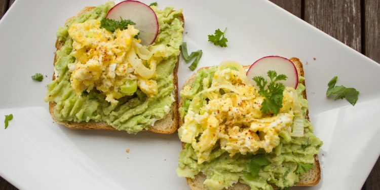 Bread With Guacamole, Parsley Leaves, Onions, and Eggs on Platter