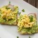 Bread With Guacamole, Parsley Leaves, Onions, and Eggs on Platter