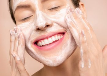 Woman With White Facial Soap on Face
