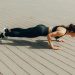 Woman in Black Tank Top and Black Leggings Doing Yoga