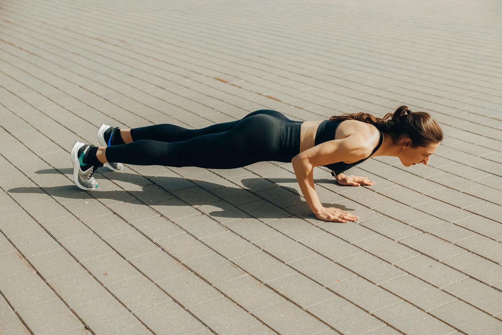 Woman in Black Tank Top and Black Leggings Doing Yoga