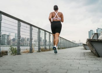 Woman in Sports Clothing Jogging