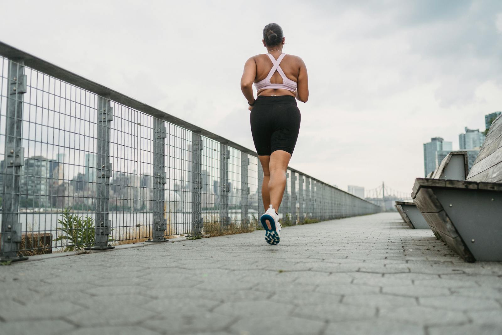 Woman in Sports Clothing Jogging