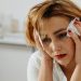 Close-Up Shot of a Sad Woman Holding a Tissue