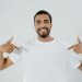 A Bearded Man Pointing at His Plain White Shirt