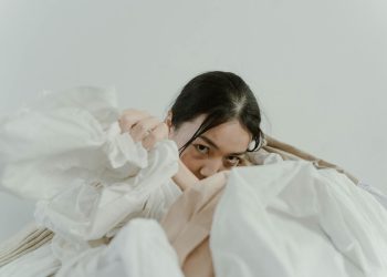 Woman's Hand in a Heap of Fabric
