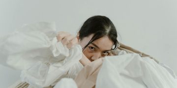 Woman's Hand in a Heap of Fabric