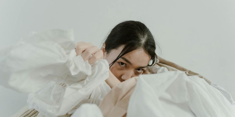 Woman's Hand in a Heap of Fabric