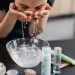 Woman in Black Shirt Washing her Face with Water