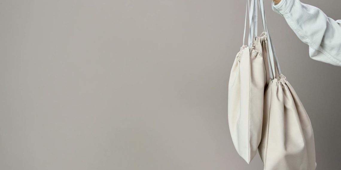 Person Holding White Leather Tote Bag