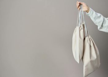 Person Holding White Leather Tote Bag
