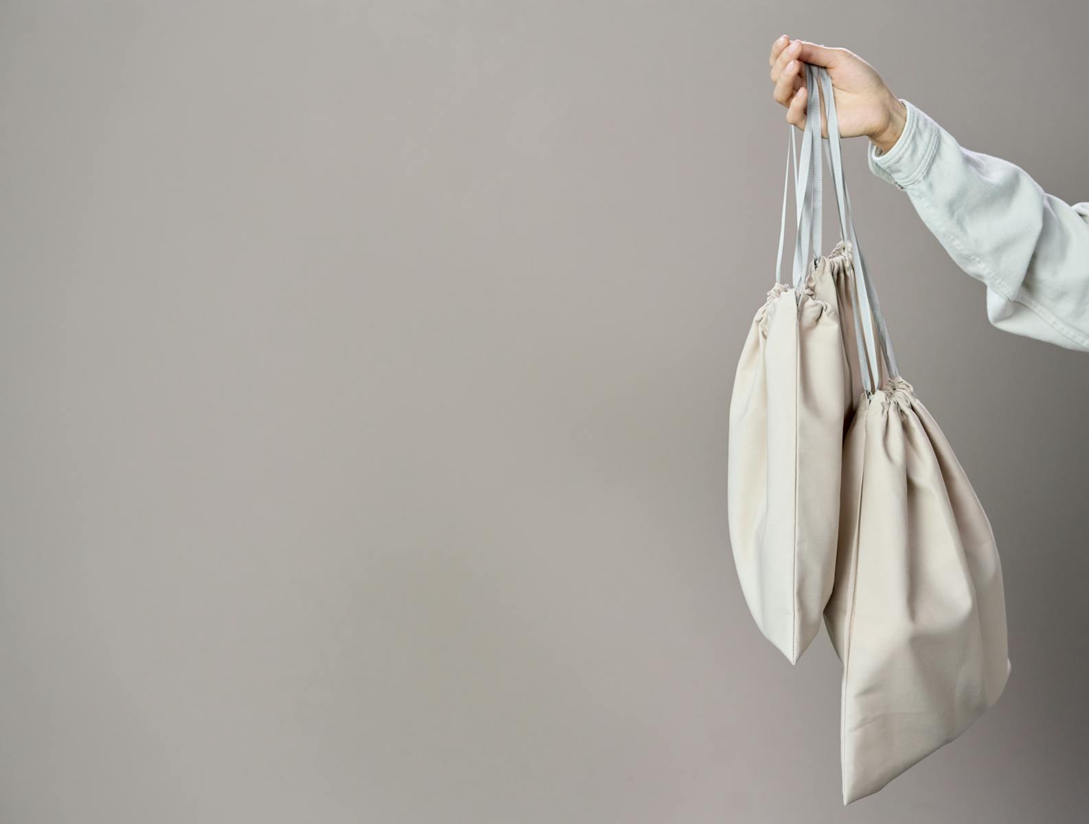 Person Holding White Leather Tote Bag